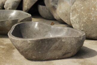 Natural stone bath tub in Curved River Rock